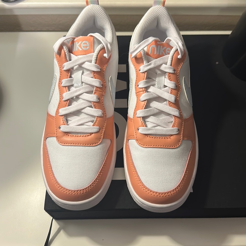 Nike pink shoes.